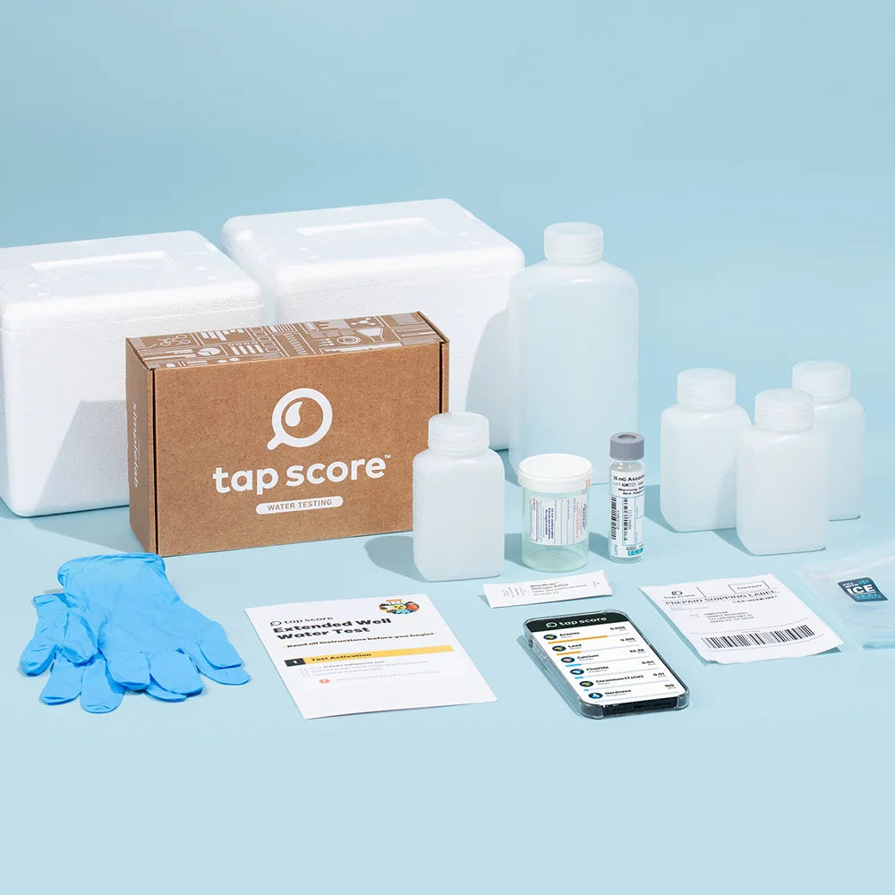 Tap Score Extended Well Water Test kit contents — sample bottles, instructions, prepaid shipping label